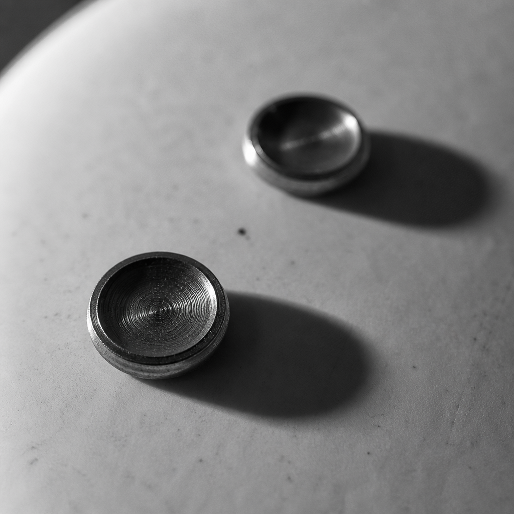 Macro of two brass buttons